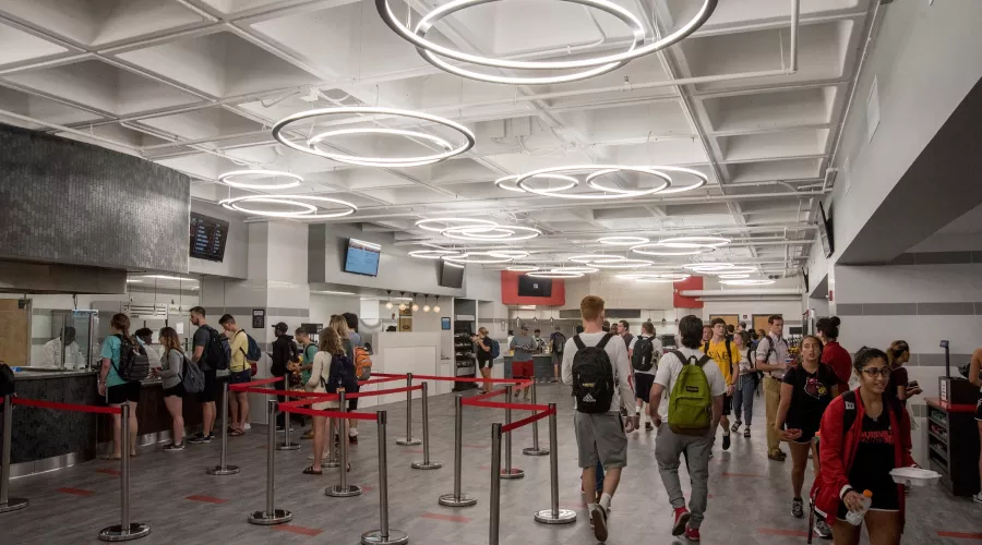 Students wait in line for food at the newly developed SAC food area
