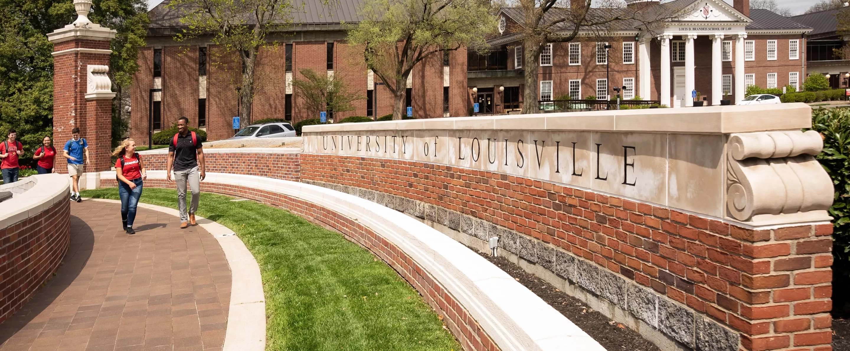 Students walking in front of Grawemeyer Hall oval
