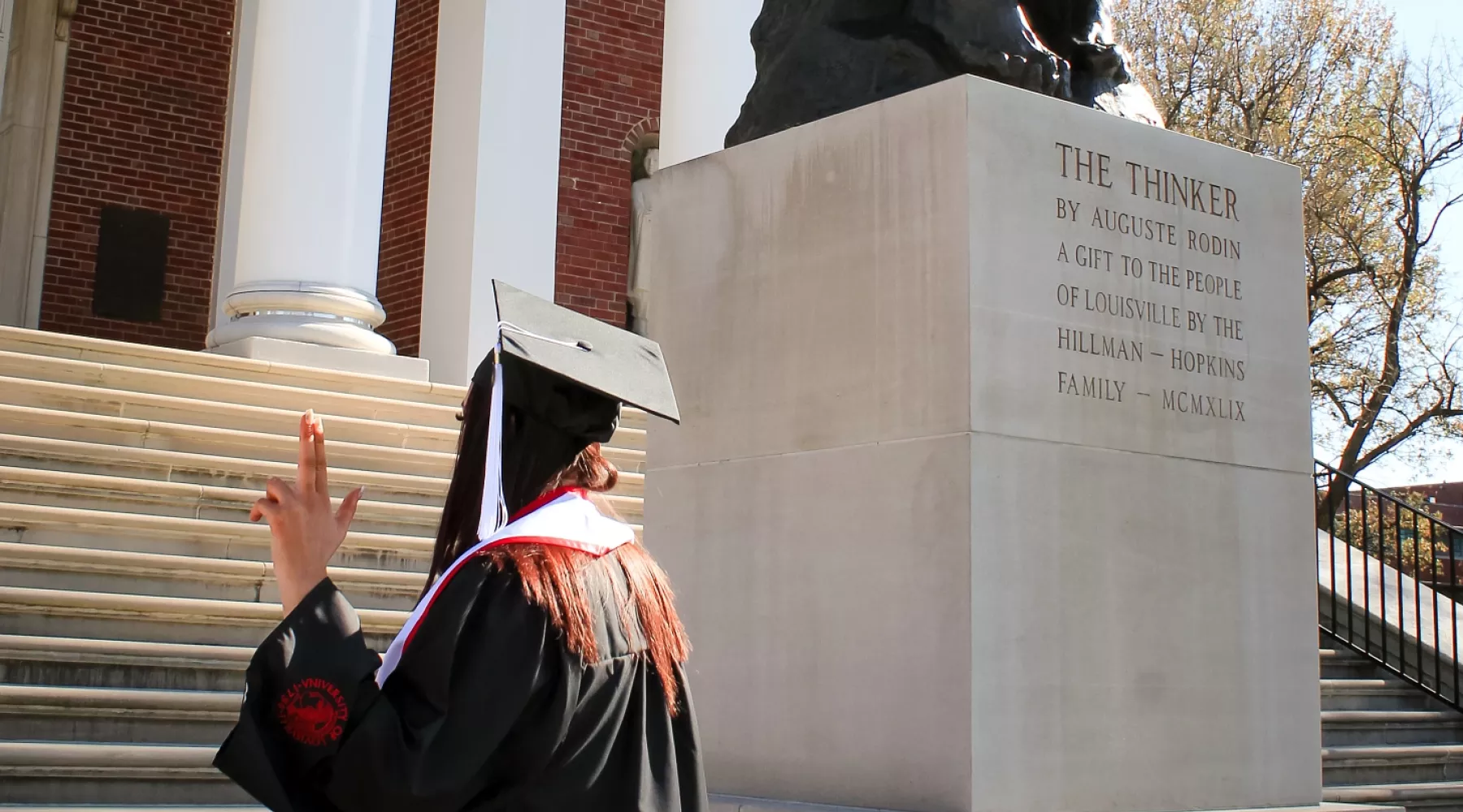 Allison Russell poses for a photo by the thinker